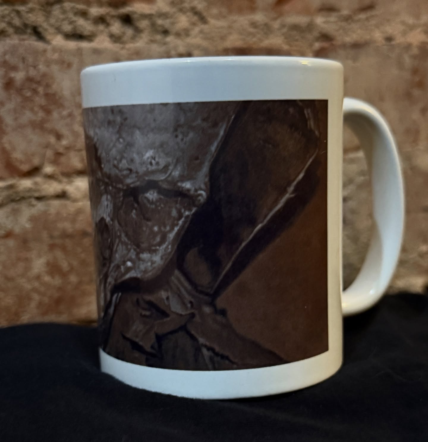 I got some coffee mugs made with one of my painting images on it…